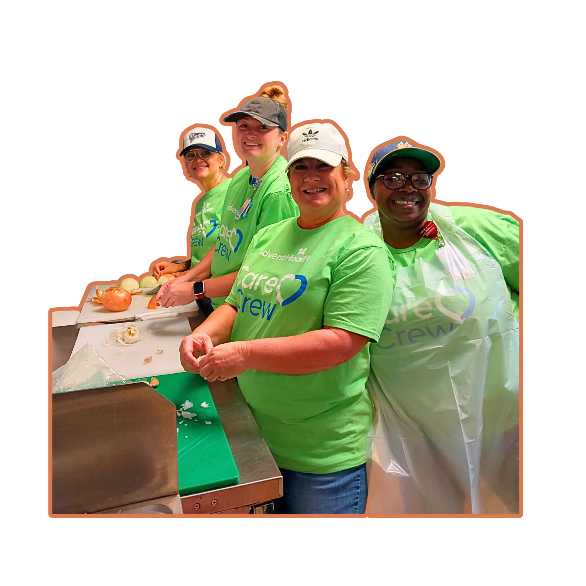 Volunteers in green Care Crew shirts preparing food together