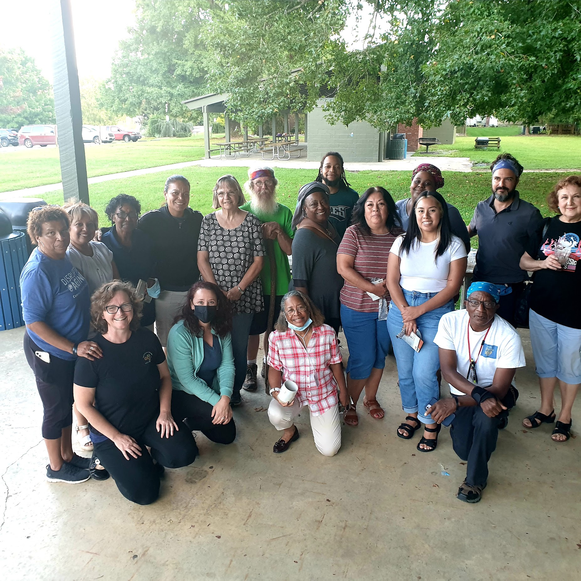 Participants in a participatory budgeting process facilitated by Sonya Jones, PhD, gathered at an outdoor pavilion
